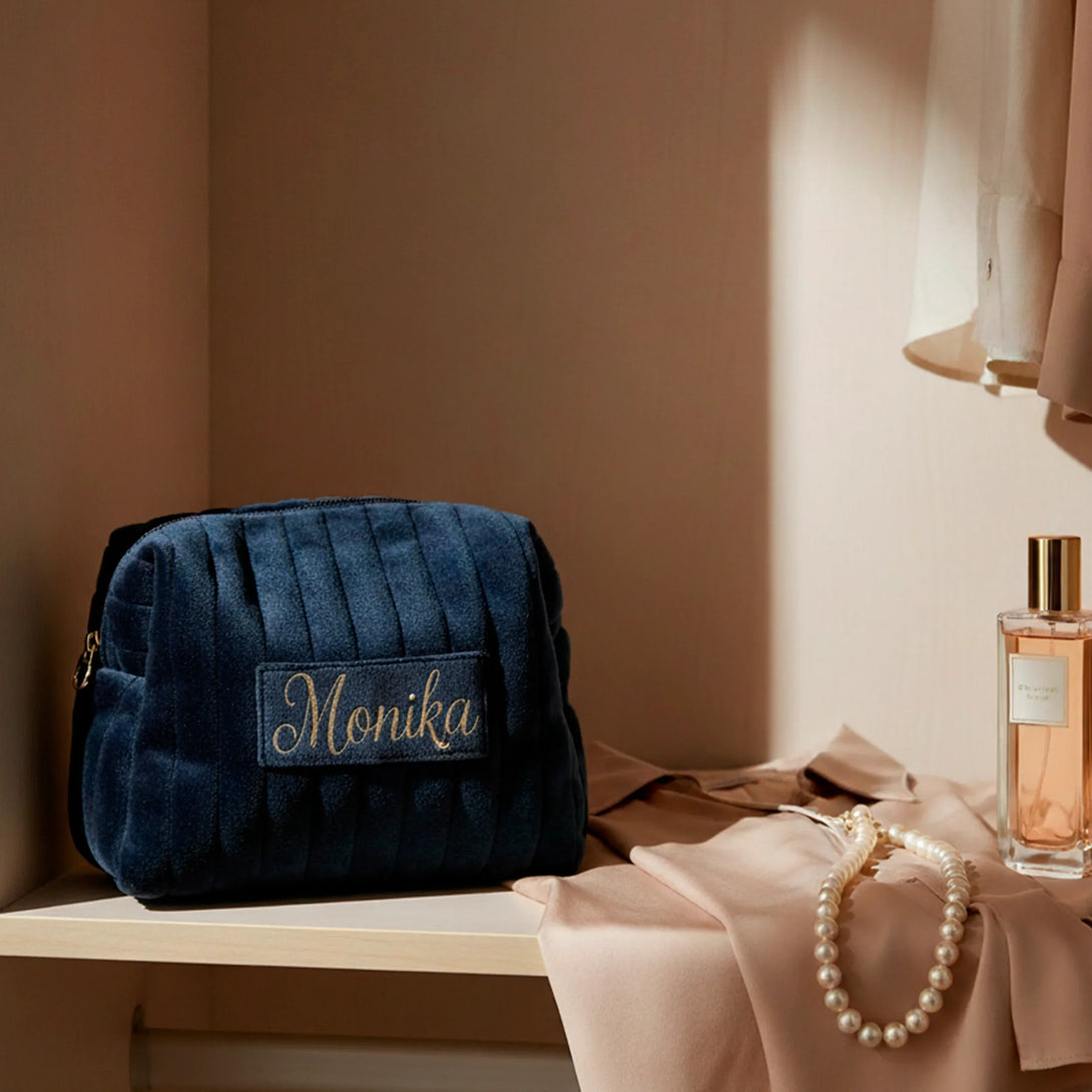 Personalized black leather wallet and belt gift set for men on a beige shelf